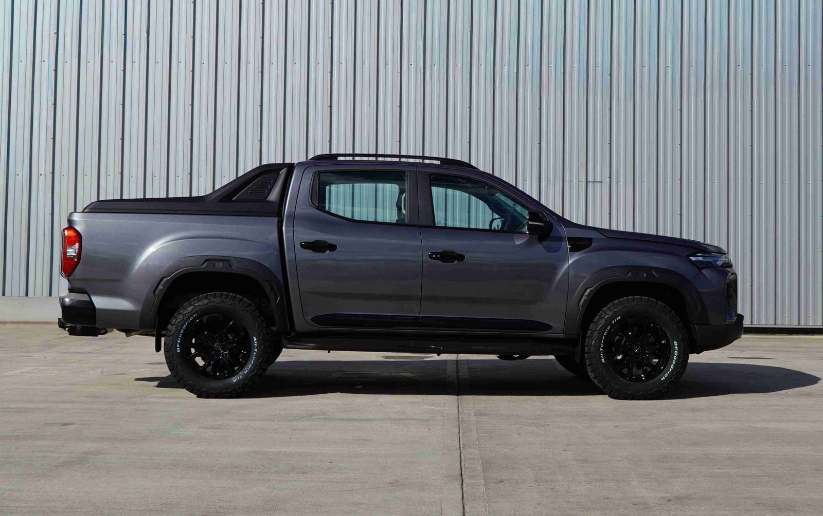 Electric pickup truck with off-road tires